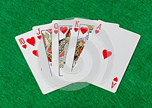 Casino playing cards on green table