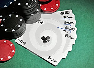 Casino poker chips with royal flush