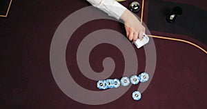 Casino Poker table with chips and cards, shallow depth of field