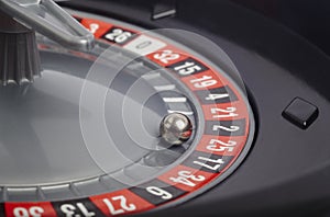 Casino roulette detail with ball in number twenty-five. Gambling