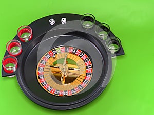 Casino roulette on green broadcloth.