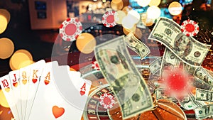 Casino with roulette, poker cards, chips and money fly with sparks, creative idea. Casino and online gamble creative. Win, concept