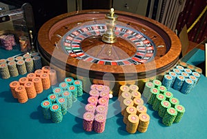 Casino roulette wheel and gambling chips