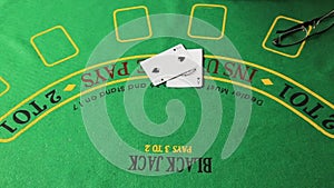 Casino table with poker player hands and playing card