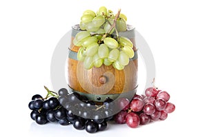 Cask with red, black and white grapes