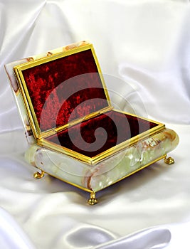 Casket from onyx in a gold frame