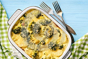 Casserole with broccoli, potatoes, eggs and cheese.