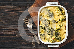 Casserole with broccoli, potatoes, eggs and cheese.