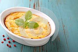 Casserole with fish in a white dish