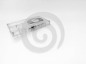 Cassette tape, object isolated on a white background, analog magnetic tape for audio recording, outdated technology