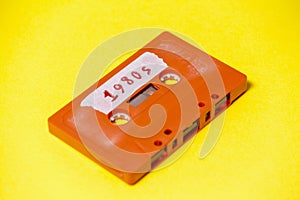 Cassette tape orange on yellow 1980s