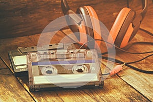 Cassette tape over wooden table. image is instagram style filtered.