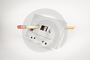 Cassette tape with pencil for rewind