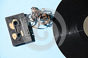 Cassette and vinyl record on a colored background