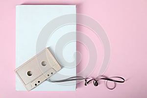 Cassette and white sheet of paper
