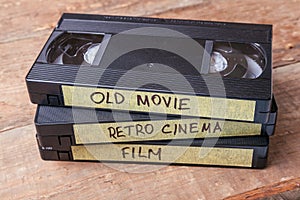 Cassettes VHS with old films on wooden boards photo