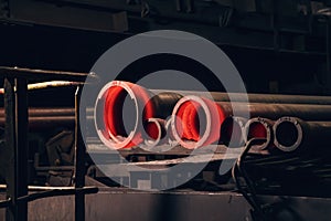 Cast hot steel or iron pipe at foundry, metalworking manufacturing metallurgy