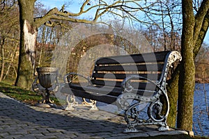 Cast iron bench, park, Castle over the lake, Nevsvizh castle - palace and castle complex, Minsk region,