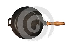 Cast iron frying pan with wooden handle isolated