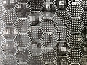 Cast iron hexagonal factory floor texture and background.