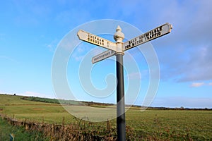 Cast iron painted finger sign post photo