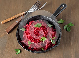 Cast iron pan with braised beetroot