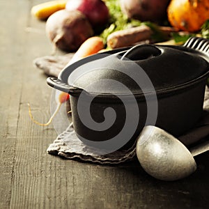 Cast iron pot and vegetables