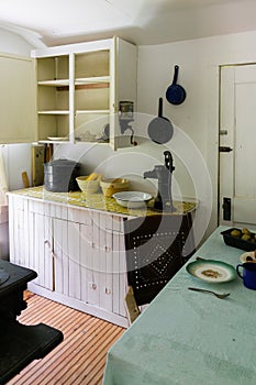 Cast iron pots and pans in a replica 1890s kitchen