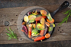 Cast iron skillet of roasted autumn vegetables photo