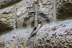 Cast iron wall bracket in old town in Florence