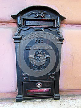 Cast metal letter box on house photo