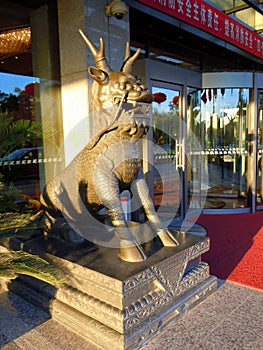 Cast metal statue of a qilin