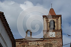 Bell tower of the Santiago el Mayor church in the Andalusian magical town of CastaÃÂ±o del Robledo, Huelva, Spain photo