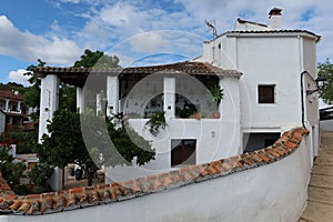 One of the typical white houses of the Andalusian magical town of CastaÃÂ±o del Robledo, Huelva, Spain photo