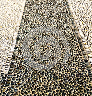 In castano primo street pavement of a curch and marble photo