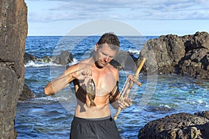 Castaway fishing with primitive tool