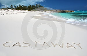 Castaway writing on a desert beach photo