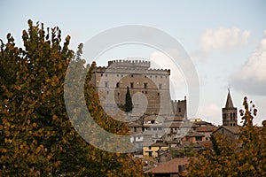 The castel on hill of soriano nel cimino and the autumn leafs photo