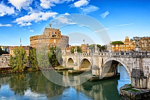 Castel Sant\'Angelo and the Sant\'Angelo bridge over Tiber river during sunny day in Rome, Italy