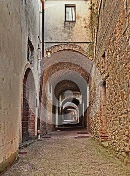 Castellina in Chianti, Siena, Tuscany, Italy: the ancient street Via delle Volte photo