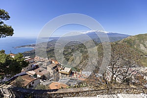 Aerial view of city and bay of the Ionian Sea and Mount Etna volcano, Castelmola, Sicily, Italy