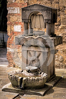 CASTIGLIONE DEL LAGO, TUSCANY/ITALY - MAY 20 : Drinking water fountain for people and animals in Castiglione del Lago Tuscany on