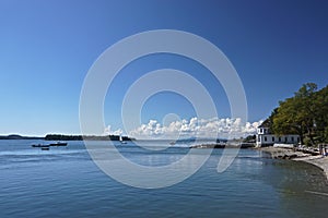 Castine, Maine, USA: Beautiful white clouds in a blue sky over the harbor at Castine