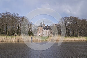 Castle behind reed in river Oude IJssel