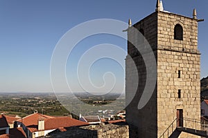 Castle bell tower with village in the background photo