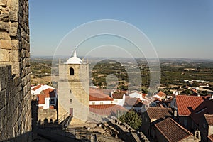 Castle bell tower with village in the background photo