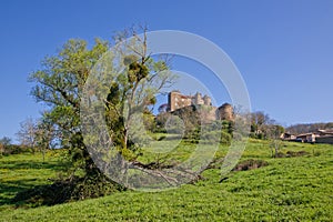Castle of Berze-le-Chatel, a medieval castle of 10th to 14th century, on its hill
