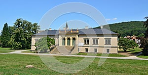 Castle Cechy pod Kosirem is classicist building on the outskirts of the park in the romantics