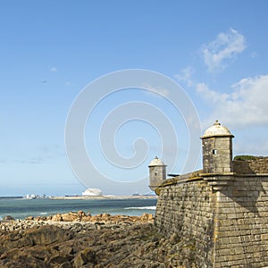 Castle of the Cheese (Matosinhos Castelo do Queijo) and surf at rocky Atlantic ocean coast in Porto photo