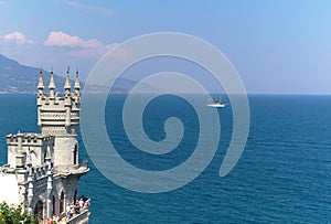 Castle on cliff, ship and sea